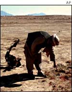 A resident of Kandahar, shows blood of a victim of the explosion