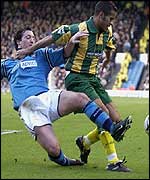 Adam Chambers holds off City new boy Robbie Fowler
