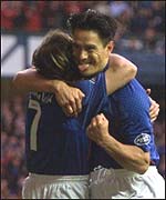 Caniggia celebrates with goal-scorer Mols