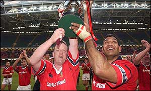 Mick Galwey and the Munster captain Jim Williams raise the trophy