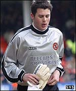 United goalkeeper Alan Combe