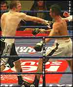 Neil Sinclair (right) about to see the referee step in to stop the fight