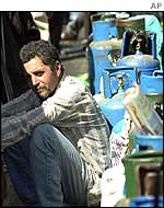 A man waits for gas supplies in Venezuela