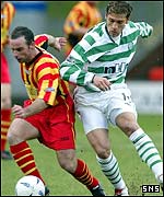 Stilian Petrov chases Thistle striker Alex Burns