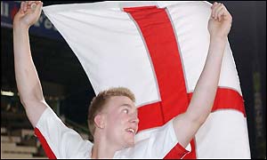 Lund poses with the England flag after their magnificent win