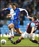 Tugay (left) avoids the challenge of Gareth Barry