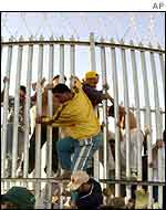 Refugees breakout from the Woomera Detention Centre, March 2002