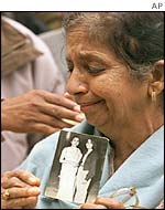 Mourner clutching picture of Kalpana Chawla,