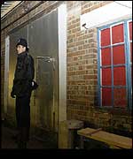 Police outside Margaret Muller's flat