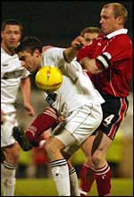 Swansea's James Thomas and Craig Liddle compete