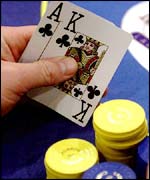 A poker hand and chips