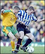 Norwich's Mark Rivers and Dagenham's Mark Rooney