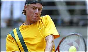 Lleyton Hewitt of Australia hammers a backhand at Alex Bogdanovic