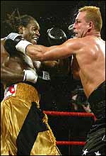 Audley Harrison rocks Rob Calloway with a left uppercut