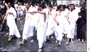 Men in wearing special white clothes (called Ihram)