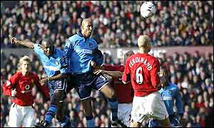 Shaun Goater rises to head the equaliser in the Manchester derby