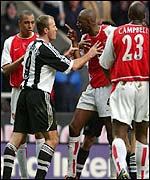 Alan Shearer (left) and Patrick Vieira exchange words at St James' Park