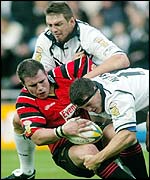 Hull's Scott Logan(top) and Adam Maher tackle Halifax's Chris Birchall