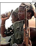 Woman Ivory Coast rebel holding gun