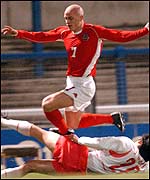 Wales' David Pipe escapes tackle from Beom-Seok Oh