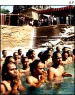 Brahmin youths perform a Varia Japan prayer in neck-deep water in Madras