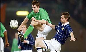 Kilbane tries out an acrobatic challenge on Scotland's Graham Alexander as the second half offers little excitement