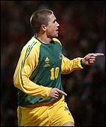 Harry Kewell celebrates scoring for Australia