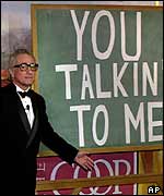 Scorsese in front of a blackboard bearing the words: 