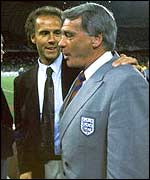 Robson (right) is consoled by West Germany coach Franz Beckenbauer 