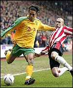 Darel Russell (left) is challenged by Danny Higginbotham
