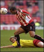 Sunderland's Phil Babb heads clear