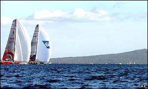 Alinghi and Team New Zealand pass Rangitoto Island during race two