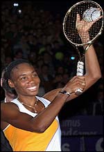 Venus Williams shows off the diamond racquet trophy