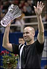 Andre Agassi holds the title aloft