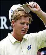 Ernie Els doffs his cap to salute his victory at the Johnnie Walker Classic