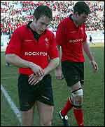Rhys Williams and Michael Owen troop off dejectedly after losing to Italy 