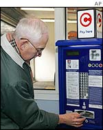 Roger Wooley from Kent pays at a self-service point in Westminster