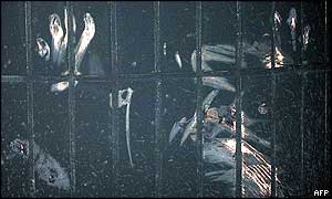Hands, fingers and nails marks seen on the soot-covered floor of the charred subway station 