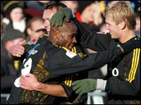 Ayorinde congratulated by his AIK team mates after a goal