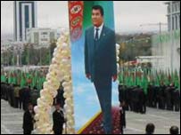 A poster of the president is carried through the streets of Ashgabat during a parade to mark the tenth anniversary of independence from the USSR