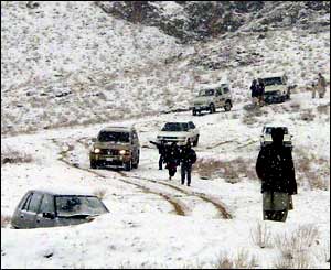 Four-wheel drive vehicles slowly make there way through the Bolan Pass near Quetta