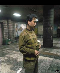 Man holding flowers on the concourse