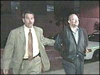 Al-Arian (R) being arrested