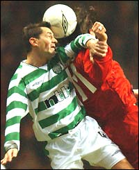 Celtic's Jackie McNamara and Ioannis Amanatidis of Stuttgart contest a high ball