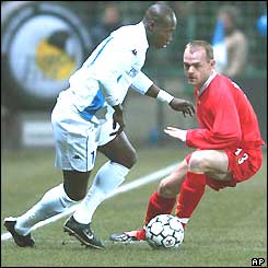 Liverpool's Danny Murphy is left wrong-footed by Auxerre's Mustapha Faye