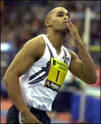 Jason Gardener salutes the crowd after powering his way to victory in the men's 60m final