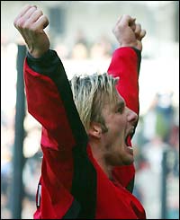 David Beckham celebrates a 90th-minute Ole Gunnar Solskjaer equaliser