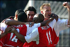 Arsenal players celebrate a 5-1 win over Man City at Maine Road