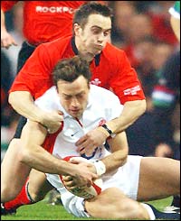 England's Dan Luger is tackled by Gareth Cooper of Wales