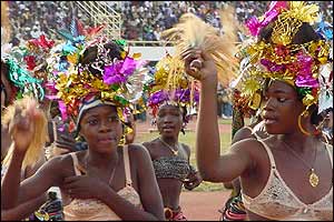 Women in headdresses and bras